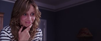 Movie still from “The Departed” (2006), directed by Martin Scorsese – A beautiful young lady posing for a picture; Close Up shot, Over the shoulder angle