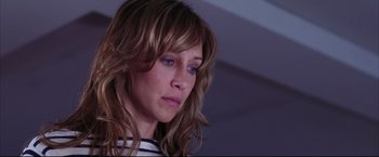 Movie still from “The Departed” (2006), directed by Martin Scorsese – A person with long brown hair; Close Up shot, High angle