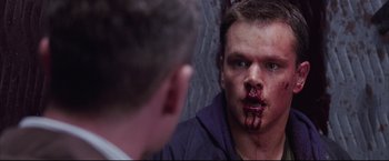 Movie still from “The Departed” (2006), directed by Martin Scorsese – A man with blood all over his face looking into a mirror; Close Up shot, Over the shoulder angle