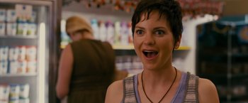 Movie still from “The Dictator” (2012), directed by Larry Charles – A person with short black hair; Close Up shot, Over the shoulder angle