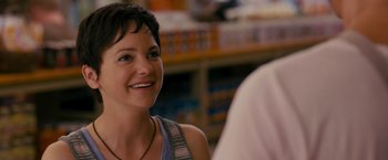 Movie still from “The Dictator” (2012), directed by Larry Charles – A woman that is sitting in front of a man; Close Up shot, Over the shoulder angle