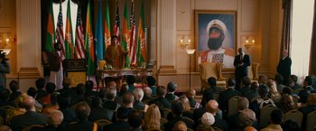 Movie still from “The Dictator” (2012), directed by Larry Charles – A crowd of people sitting in front of an audience; Wide shot, Over the shoulder angle