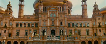 Movie still from “The Dictator” (2012), directed by Larry Charles – A large building with a golden dome on the top of it; Extreme Wide shot, Low angle