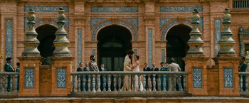 Movie still from “The Dictator” (2012), directed by Larry Charles – A group of people standing on a balcony; Extreme Wide shot, Low angle