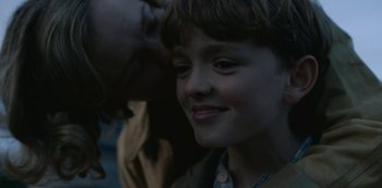 Movie still from “The Dig” (2021), directed by Simon Stone – A person with a child; Close Up shot, Over the shoulder angle
