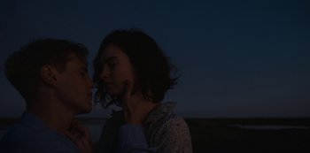 Movie still from “The Dig” (2021), directed by Simon Stone – A couple of people standing next to each other on a field; Close Up shot, Over the shoulder angle