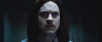 Movie still from “The Dirt” (2019), directed by Jeff Tremaine – A person with long hair; Close Up shot, Over the shoulder angle