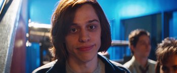 Movie still from “The Dirt” (2019), directed by Jeff Tremaine – A person with long hair; Close Up shot, Over the shoulder angle