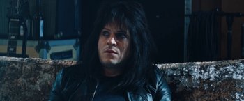 Movie still from “The Dirt” (2019), directed by Jeff Tremaine – A person wearing a black jacket; Close Up shot, Low angle