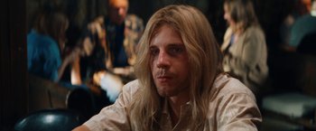 Movie still from “The Dirt” (2019), directed by Jeff Tremaine – A person with long blonde hair; Close Up shot, Low angle