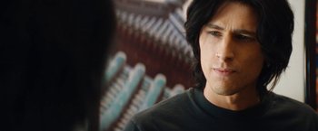 Movie still from “The Dirt” (2019), directed by Jeff Tremaine – A person with long black hair; Close Up shot, Over the shoulder angle