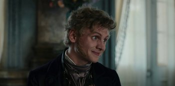 Movie still from “The Empress” (2022), created by Katharina Eyssen – A person wearing a suit and tie; Close Up shot, Over the shoulder angle