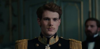 Movie still from “The Empress” (2022), created by Katharina Eyssen – A person wearing a military uniform; Close Up shot, Low angle