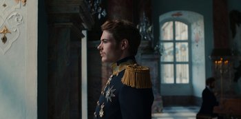 Movie still from “The Empress” (2022), created by Katharina Eyssen – A man in a military uniform looking to his left; Medium shot, Low angle