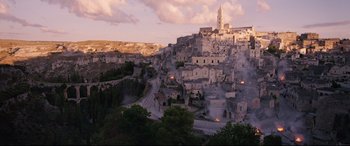 Movie still from “No Time to Die” (2021), directed by Cary Joji Fukunaga – A view of a town with a church on top of it; Extreme Wide shot, High angle