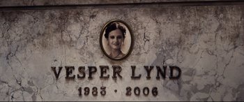 Movie still from “No Time to Die” (2021), directed by Cary Joji Fukunaga – A photo of a woman in a circle on a stone wall; Extreme Close Up shot, Low angle