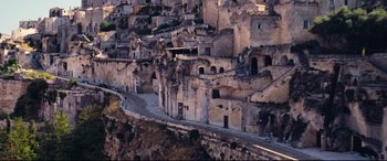 Movie still from “No Time to Die” (2021), directed by Cary Joji Fukunaga – An aerial view of an old town in the middle of the day; Extreme Wide shot, High angle