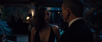 Movie still from “No Time to Die” (2021), directed by Cary Joji Fukunaga – A man and a woman are talking to each other; Close Up shot, Over the shoulder angle