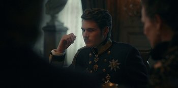 Movie still from “The Empress” (2022), created by Katharina Eyssen – A man in a military uniform sitting in front of a window; Close Up shot, Over the shoulder angle