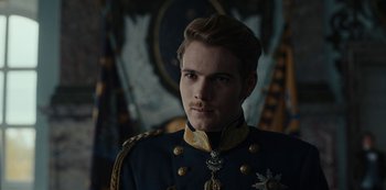 Movie still from “The Empress” (2022), created by Katharina Eyssen – A man in a military uniform is looking at the camera; Close Up shot, Over the shoulder angle