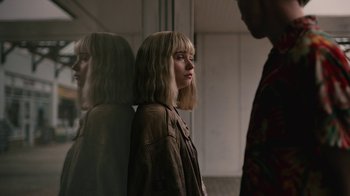 Movie still from “The End of the F***ing World” (2017), directed by Jonathan Entwistle – A woman standing in front of a mirror looking at her reflection; Close Up shot, Over the shoulder angle