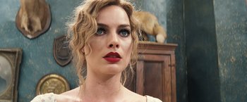 Movie still from “Babylon” (2022), directed by Damien Chazelle – A person wearing a red lipstick; Close Up shot, Low angle