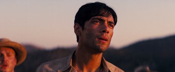 Movie still from “Babylon” (2022), directed by Damien Chazelle – A person looking up at the sky; Close Up shot, Low angle