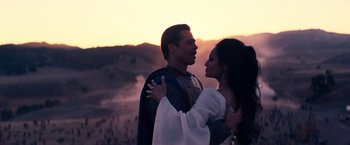 Movie still from “Babylon” (2022), directed by Damien Chazelle – A man and a woman dressed in medieval garb; Medium shot, Over the shoulder angle