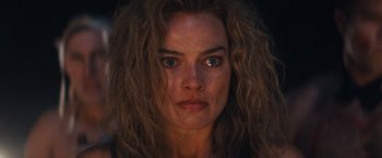 Movie still from “Babylon” (2022), directed by Damien Chazelle – A person with long hair; Close Up shot, Low angle