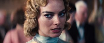 Movie still from “Babylon” (2022), directed by Damien Chazelle – A woman's face with blue eyes; Close Up shot, Over the shoulder angle