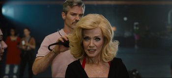 Movie still from “Nope” (2022), directed by Jordan Peele – A man is blow - drying a woman's hair; Close Up shot, Over the shoulder angle