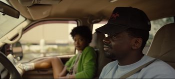 Movie still from “Nope” (2022), directed by Jordan Peele – A man and a woman sitting in the back of a car; Close Up shot, Over the shoulder angle