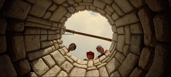 Movie still from “Nope” (2022), directed by Jordan Peele – Three men standing inside a stone structure looking up at the sky; Wide shot, Low angle