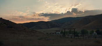 Movie still from “Nope” (2022), directed by Jordan Peele – A view of a mountain range with a sky filled with fluffy clouds; Extreme Wide shot, Low angle