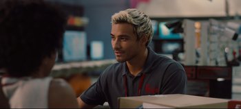 Movie still from “Nope” (2022), directed by Jordan Peele – A man sitting at a table in a room; Close Up shot, Over the shoulder angle