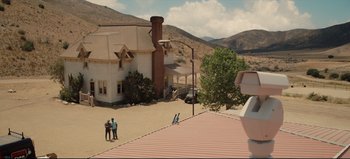 Movie still from “Nope” (2022), directed by Jordan Peele – A group of people standing on the roof of a house; Extreme Wide shot, High angle