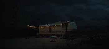 Movie still from “Nope” (2022), directed by Jordan Peele – An rv is parked in the middle of the night; Extreme Wide shot, Low angle