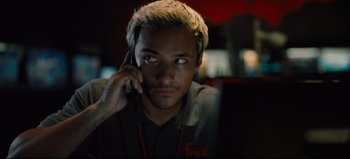 Movie still from “Nope” (2022), directed by Jordan Peele – A young man is talking on a cell phone; Close Up shot, Low angle
