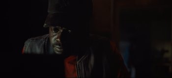 Movie still from “Nope” (2022), directed by Jordan Peele – A person wearing a hat; Close Up shot, Low angle