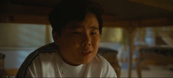 Movie still from “Nope” (2022), directed by Jordan Peele – A young man is looking into the distance; Close Up shot, Low angle