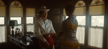 Movie still from “Nope” (2022), directed by Jordan Peele – A man and a woman wearing cowboy hats; Medium shot, Over the shoulder angle