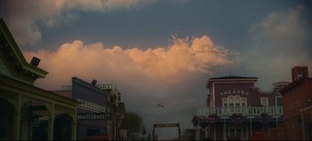 Movie still from “Nope” (2022), directed by Jordan Peele – A sky filled with lots of fluffy white clouds at dusk; Extreme Wide shot, Low angle