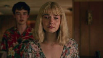 Movie still from “The End of the F***ing World” (2017), directed by Jonathan Entwistle – A woman with blonde hair and a floral dress; Close Up shot, Over the shoulder angle