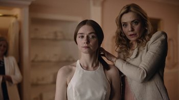 Movie still from “The End of the F***ing World” (2017), directed by Jonathan Entwistle – A woman is getting her hair done by a stylist; Close Up shot, Over the shoulder angle