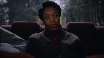 Movie still from “The End of the F***ing World” (2017), directed by Jonathan Entwistle – A woman sitting in a car looking into the distance; Close Up shot, Low angle