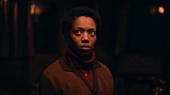 Movie still from “The End of the F***ing World” (2017), directed by Jonathan Entwistle – A person wearing a brown jacket and a red sweater; Close Up shot, High angle