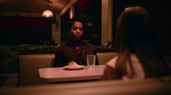Movie still from “The End of the F***ing World” (2017), directed by Jonathan Entwistle – A man sitting at a table in front of a plate of food; Medium shot, Over the shoulder angle