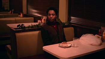 Movie still from “The End of the F***ing World” (2017), directed by Jonathan Entwistle – A woman sitting at a table in a restaurant; Medium shot, High angle