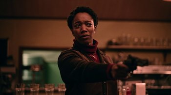Movie still from “The End of the F***ing World” (2017), directed by Jonathan Entwistle – A woman holding a wine glass in her right hand; Medium shot, Over the shoulder angle