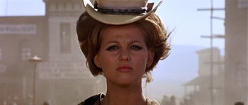 Movie still from “Once Upon a Time in the West” (1968), directed by Sergio Leone – A person wearing a cowboy hat; Close Up shot, Low angle